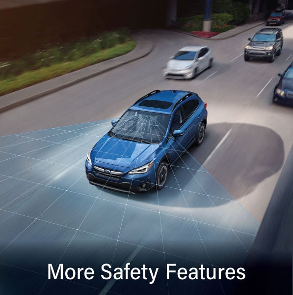 A Subaru Crosstrek in blue with the words &ldquo;More Safety Features&ldquo;. | Salina Subaru in Salina KS